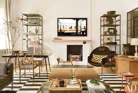 Utilizing a bookshelf for design purposes is one unique living room wall décor idea. Painted Brick Wall Ideas And Inspiration Architectural Digest