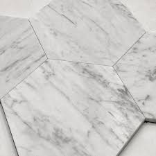 I have no idea if these heat resistant tiles will actually not melt like cheese in a grilled cheese sandwich either. 5 Carrara Hexagon Marble Peel And Stick Tile Tile Club