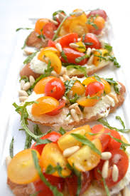 For the tomatoes, up to an hour before you're serving, combine the shallots, garlic, and vinegar in a medium bowl. Tomato Bruschetta Recipe Barefoot Contessa Make Ahead Appetizers From Barefoot Contessa Whipped Feta Crostini Adapted From Ina Garten Barefoot Contessa Food Network Decorate