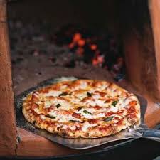 Wood Fired Pizzas With Salami Basil Recipe Wood Fired Oven Recipes Wood Oven Pizza Wood Fired Pizza