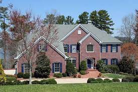 I just purchased a home where the landscaping bed is up against the brick front wall. Brick Home Front Entry House Front House Exterior House Landscape