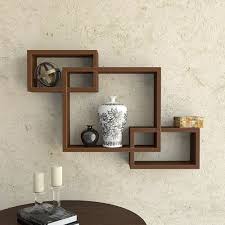 Put a statement wall to work with floating glass shelves. Woodkartindia Interlock Wall Shelves Set Of 3 For Living Room Decor Wall Decor Enterscting Wall Shelf For Home Office Brown Amazon In Furniture
