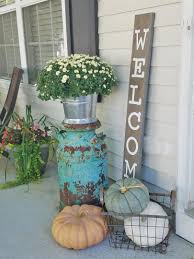 Hanging up a wreath is the best way to give your front porch a little fall flair. Front Porch Ideas For Fall Fall Outdoor Decor Fall Decorations Porch Front Porch Decorating