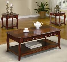 This nesting 2 piece coffee table set provides the perfect tabletop solution for all needs. Warm Brown Cherry Finish Traditional 3pc Coffee Table Set