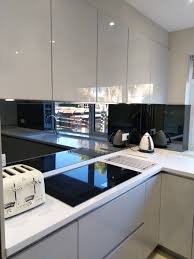 Over at hgtv you'll find this snazzy kitchen to feast your eyes upon. Uzivatel Colliers Kitchens Na Twitteru Designed Using High Gloss Light Grey Cabinetry Topped With Designer White Corian Finished With Siemens Appliances And Smoked Grey Mirror Splashbacks This Kitchen Went From Dark And