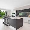 If you already have a tiled backsplash, you can use the same material for the soffit to give your kitchen a. 1
