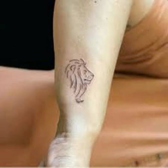 Minimalist Lion Tattoo on Arm | Small lion tattoo for women simple, Simplistic lion tattoo, Lion