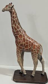 My latest polymer clay sculpt is this Giraffe standing 2 feet tall. This is  my first time using "Cosclay". Good stuff.