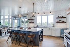 This affordable dining table is made from solid pine wood, and it is mounted on traditional spindle legs for an authentic farmhouse look. Modern Eclectic Farmhouse With Delightful Design Features In Michigan