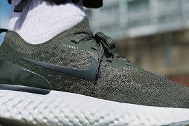 A black nike react foam midsole and rubber outsole with hints of pink adds for durable cushioning, while teal wraps the tpu heel clip to give off that south beach. Nike Epic React Flyknit Cargo Khaki On Foot Shots The Drop Date