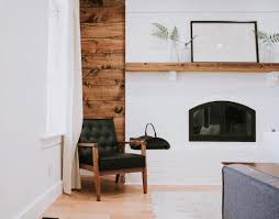 Black And White Fireplace Wall Massive White Brick Fireplace With A Shiplap Wall Behind It A Black Leather Chair Compliments The Space White Brick Fireplace Fireplace Design Brick Fireplace