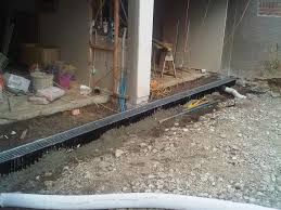 The house is a one story ranch with the garage in the basement of the house. Subsoil Drainage Services Auckland Euro Plumbing Ltd