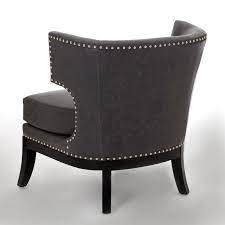 More of a cream color. Contemporary Wingback Studded Armchair