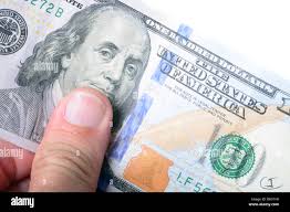 One dollar bill usa holding hi-res stock photography and images