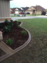 After pouring the concrete, round the inside edge of the curb with a trowel. Concrete Curbing