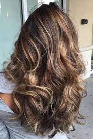 Layered And Curled Dark Hair With Blonde Highlights On Woman Wearing A Light Grey Top Seen Hair Styles Brown Hair With Blonde Highlights Hair Color Balayage
