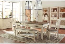 The opulent brown stained finish flows beautifully over the decorative pilasters and ornate detailed appliques to create a rich elegant atmosphere to any dining experience. Signature Design By Ashley Bolanburg Relaxed Vintage Rectangular Dining Room Table With 6 Drawers Wayside Furniture Dining Tables