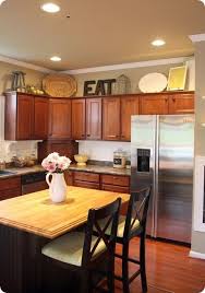 How To Decorate Above Kitchen Cabinets Decorating Above Kitchen Cabinets Kitchen Cabinets Decor Home Kitchens