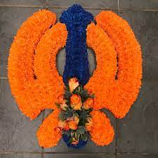 Dried flower arrangements artificial flower arrangements funeral flower arrangement flower arrangement boxes for flower arrangements silk flower funeral & condolence flower arrangements. Khanda Orange Blue Buy Online Or Call 01474 355007