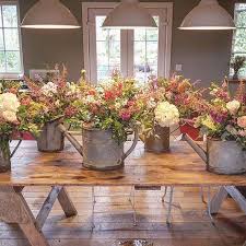 This Weekends Bride Definitely Embraced The Secret Herb Garden Style When She Asked For These Love Watering Can Centerpieces Farmer Wedding Flower Arrangements