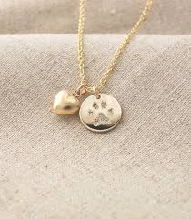 Keep Your Beloved Pets Paw Print Close To Your Heart A Name Can Be Engraved On The Back Of The P Paw Print Pendant Pet Memorial Jewelry Personalized Pendant