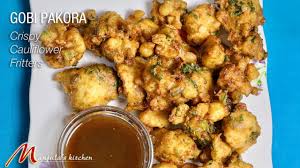 Common varieties of pakora use onion, eggplant, potato, spinach, plantain, paneer, cauliflower, tomato, or chili pepper, but other foodstuffs can be made into pakoras such as meat or fish. Gobi Pakoras Crispy Cauliflower Fritters Manjula S Kitchen Indian Vegetarian Recipes