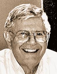 Who built the engine that powered the first airplane?