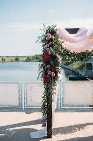Maybe you would like to learn more about one of these? Wedding Arch Decorated With Burgundy Flowers And Eucalyptus On The Riverside Stock Photo Picture And Royalty Free Image Image 96783961