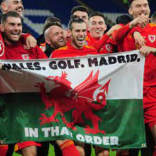 Gareth bale laughed and danced with his wales teammates behind a flag that carried the message: Gareth Bale And That Wales Golf Madrid Flag Real Are Not Amused Gareth Bale The Guardian