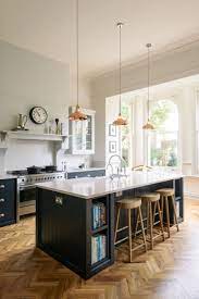 Copper Pendant Lights Hang Above A Beautiful Big Island In The Crystal Palace Kitchen By Devol Interior Design Kitchen Kitchen Design Home Decor Kitchen