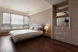 Light wood furniture on a dark wood floor offers a striking look. 15 Amazing Bedroom Designs With Wood Flooring Rilane Apartment Bedroom Design Modern Bedroom Interior Modern Bedroom Design