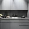 Matching the tone of the hardwood floor, this kitchen contrasts brushed aluminum appliances with a multitude of light wood cabinets. 1