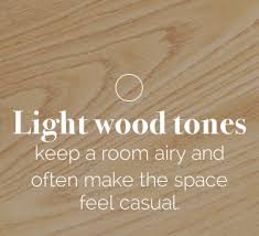 Arch design in lobby with wooden flooring and traditional dining furniture. Tips For Mixing Wood Furniture With Wood Flooring Amish Outlet Store