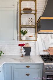 Backsplash Is A White Crackle Subway Tile With Black Grout And Marble Slab Behind The Range Kitchen Marble White Kitchen Tiles Open Kitchen Shelf Styling