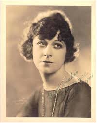 Conferring about an upcoming Actor's Fund Benefit in 1923 are Rudy,  actresses Nora Bayes and Blanche Bates, producer Joseph Frohman and Natacha  Rambova