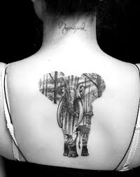 Elephant with colorful butterfly tattoo design for the back. 51 Exceptional Elephant Tattoo Designs Ideas Tattooblend