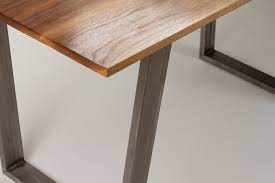 It's made from solid wood, with a circular surface set on four flared, tapered legs. Modern Dining Table Solid Wood And Trapezoid Steel Legs Living Room Custom Table Vanport Furniture