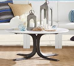 The simple open cross brace design articulates refinement and elegance echoed by the luxury of black marble. Jayne Indoor Outdoor Marble Top Coffee Table Pottery Barn