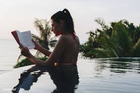 Download Premium Image Of Woman Reading A Book In The Swimming Pool 418244 Woman Reading Female Images Beach Books