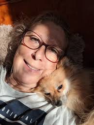 My girl and boy! Willow is pom, and gabe is a deer head chihuahua..willow  is all wet from the rain. I love when their hair crimps!