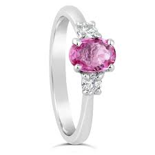 This gem given to the princess was oval shaped, surrounded by a halo of round diamonds and flanked by two pear shaped diamonds. 18ct White Gold Pink Sapphire Diamond Engagement Ring