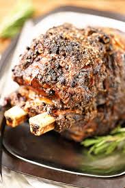 When you are done seasoning, place the prime rib with the fat side up in a deep backing dish because we don't want to loose all the wonderful juices. Bone In Prime Rib Roast Recipe Bowl Me Over