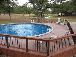 This article will guide you through the steps of building a rectangular deck around a round pool. Above Ground Pool Deck Jets And Dark Blue Liner Lavernia Tx Above Ground Pool Decks Round Above Ground Pool Above Ground Pool Decks Ideas