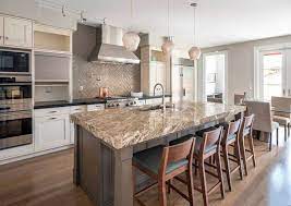 It looks like a kitchen from some kingdom. White Kitchen Cabinets With Dark Countertops Designing Idea