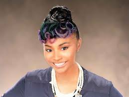 This black hair has pastel rainbow highlights on one side of the head, creating a gorgeous pattern of bright and dark when worn in a fishtail or other braided style. Beautiful Updo Hairstyle With Rainbow Highlights From Aniya Oden