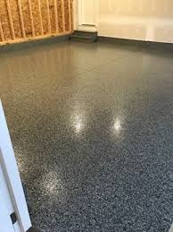 Most garages are dark and cold with nothing more than insufficient overhead lighting. Epoxy Floor In Dark Grey Flake For Garages Basements Recreation Rooms Home Office Gyms Residential And Commerc Epoxy Floor Garage Floor Epoxy Garage Floor