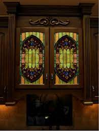 Step 9 in installing glass inserts to existing paneled cabinets is to insert the glass. Stained Glass For Cabinet Doors