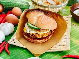 Mcdonald's malaysia's version of nasi lemak burger consists of a juicy coconut flavoured chicken thigh patty coated with a cornflake crunch, and topped with a rich, sweet & spicy sambal sauce, fried egg, caramelized onions and cucumber slices. 6 Things That Will Taste Great With A Nasi Lemak Twist