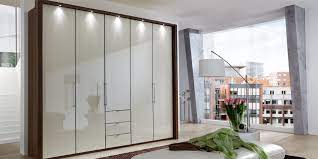 Our fully loaded option, this one takes the cake when it comes to storing your essentials. Contemporary Wardrobe Loft Wiemann Wooden With Swing Doors With Drawer