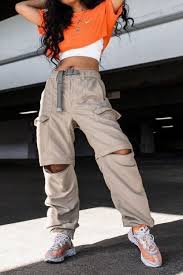 Baddie 90s Aesthetic Vintage Outfits Largest Wallpaper Portal Two young women, dressed in 90s grunge fashion, one wearing a black outfit, with multiple belts and red sneakers, the other in checkered ankle trousers, white cropped top, and a cropped yellow jacket. baddie 90s aesthetic vintage outfits